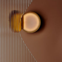 Powder compact wall light