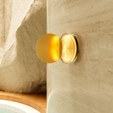 Powder compact wall light